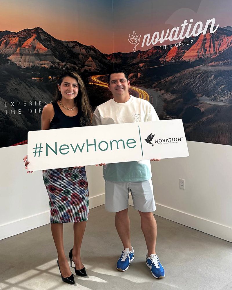 Lesly Liechty with a client on closing day at the title company